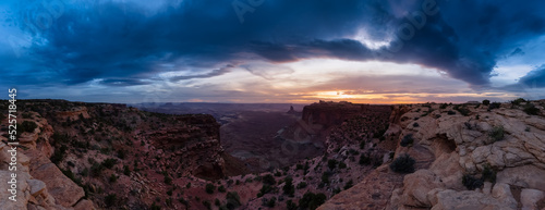 Scenic Panoramic View of American Landscape and Red Rock Mountains in Desert Canyon. Cloudy Sunset Sky. Canyonlands National Park. Utah, United States. Nature Background Panorama