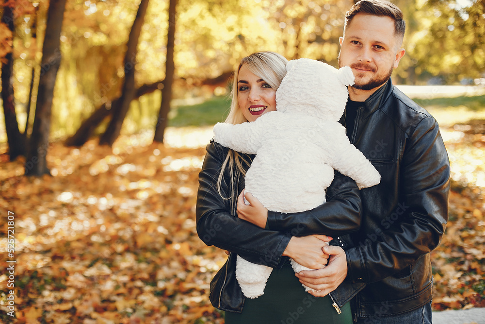 Family with daughter in a autumn park Family with daughter in a autumn park