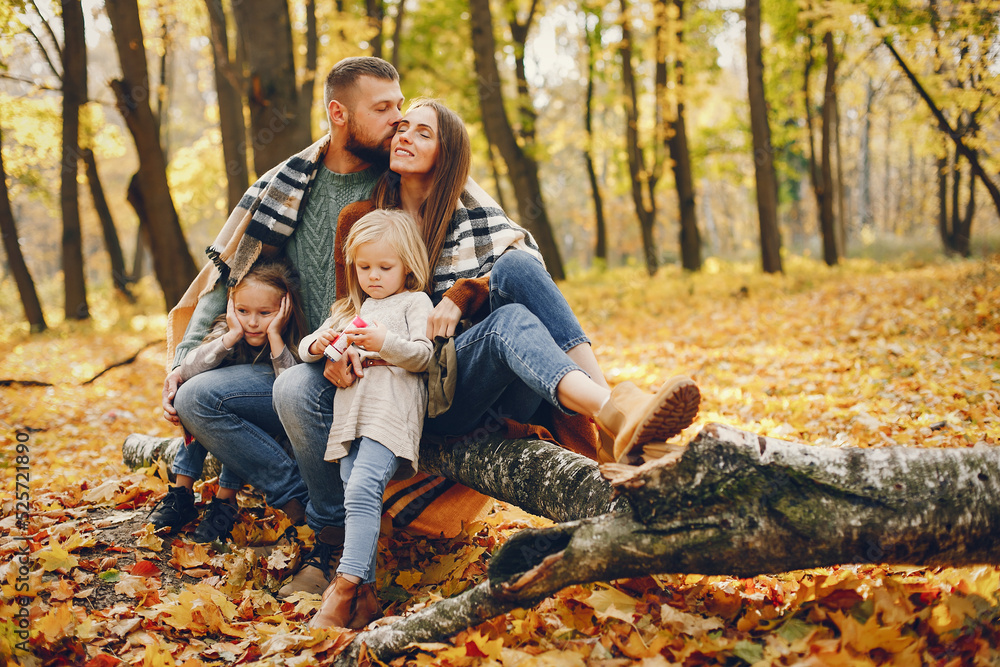 Family with cute kids in a autumn park Family with cute kids in a autumn park