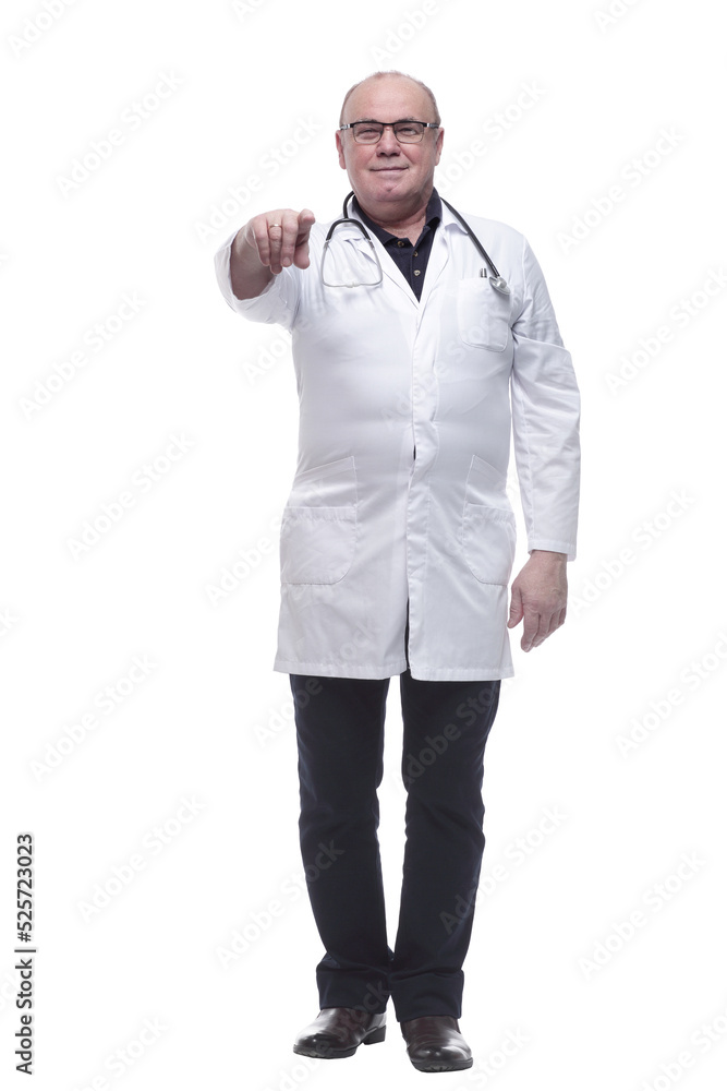 in full growth. smiling doctor pointing at you in full growth. smiling doctor pointing at you