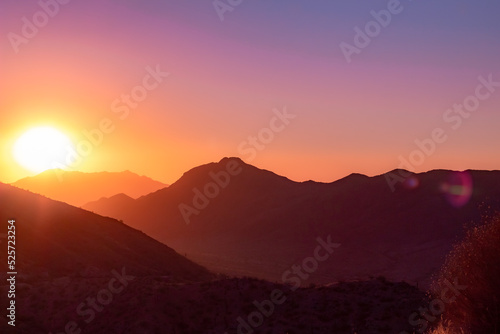 Pink sunset in the Phoenix Arizona Sonoran Desert mountains