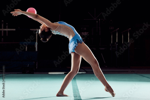 Fitness, wellness and sports woman dance in sport event, training exercise workout or concert in the gym. Wellness, dancer or athlete girl with ball doing creative health performance.