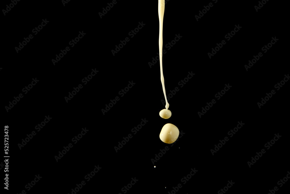 Fototapeta premium Milk droplet on black background