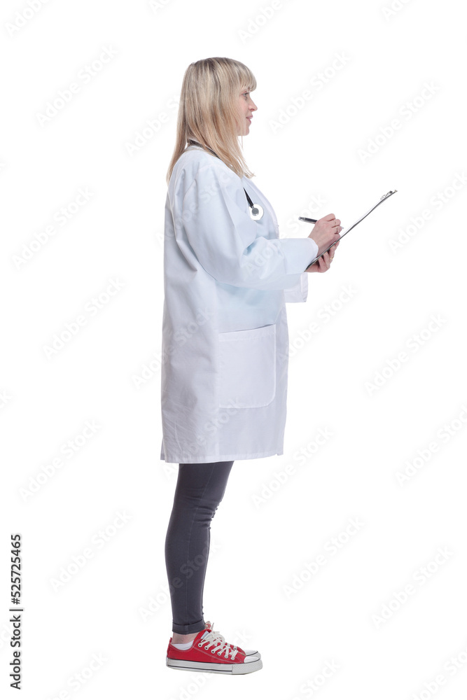 young female doctor making notes in a clipboard . young female doctor making notes in a clipboard .
