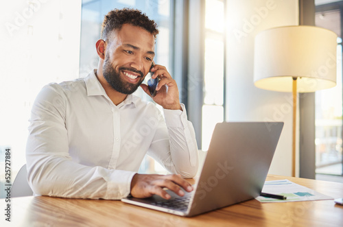 Management, planning and networking phone call by happy business man. Talking to client while working on a laptop in corporate office. Professional worker checking an online calendar for appointment