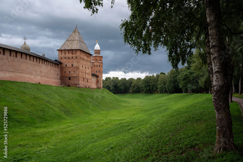 View of the wall of the Novgorod Kremlin, Pokrovskaya Tower and Kokouy Tower on a summer day, Veliky Novgorod, Russia photo