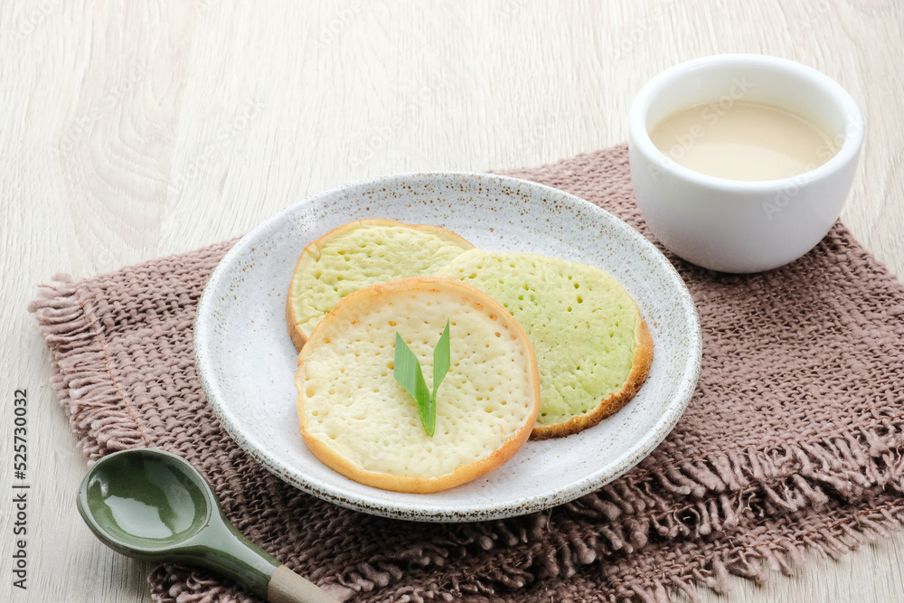 Serabi or Surabi, Indonesian pancake made of flour, rice flour and coconut milk. Served with palm sugar sauce. Sweet and savory.
Serabi or Surabi, Indonesian pancake made of flour, rice flour and coconut milk. Served with palm sugar sauce. Sweet and savory.