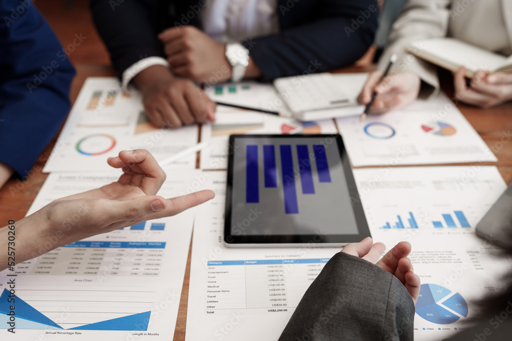 Analytics intelligence concept. Group of business people discuss current financial and economic on laptop for investment at the meeting Analytics intelligence concept. Group of business people discuss current financial and economic on laptop for investment at the meeting