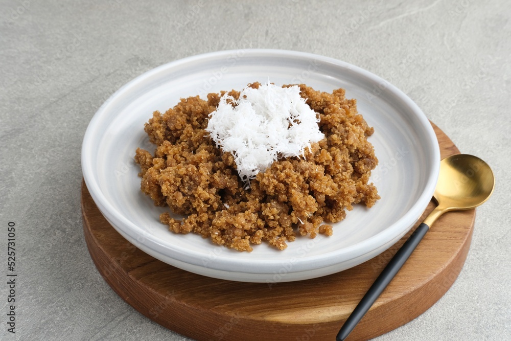 Tiwul, a traditional Indonesian food, is a staple food substitute for rice made from cassava. Usually eaten with a sprinkling of grated coconut. Tiwul, a traditional Indonesian food, is a staple food substitute for rice made from cassava. Usually eaten with a sprinkling of grated coconut.