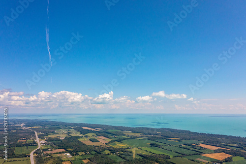 Innisfil water front beach shore line with farm land and lake simco in view  photo