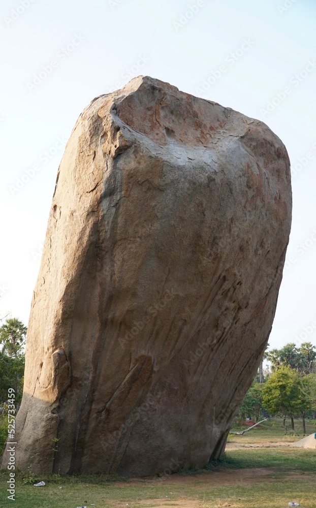 Giant granite rock against blue sky background in Mahabalipuram ...