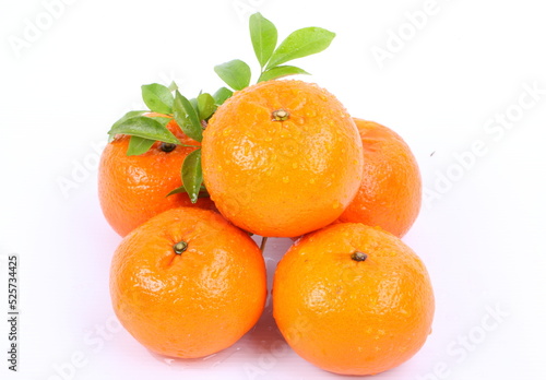 Oranges with water drops on a white background