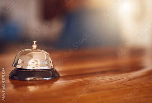 Service bell at information desk at a hotel, motel or restaurant for hospitality industry background. Customer service or help at receptionist in a luxury suite for tourism business