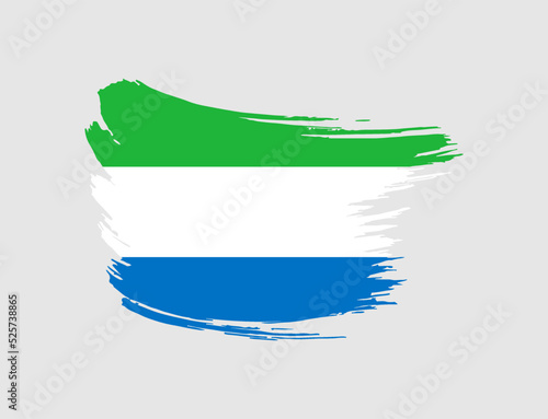 Stain brush painted stroke flag of Sierra Leone on isolated background