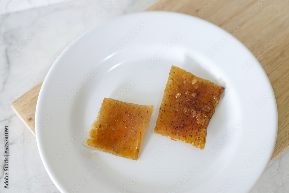Fried pork skin on a white plate. Pig food culinary cuisine. Fried pork skin on a white plate. Pig food culinary cuisine.