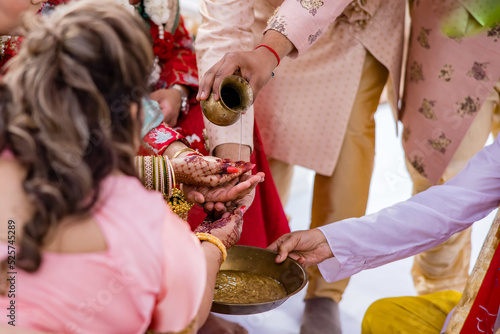 Indian Hindu wedding ceremony pooja hands close up 