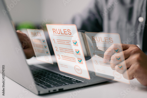 Businesspeople are reviewing policies, generating checklists, and examining rule lists. idea of corporate rules, limitations, laws, and regulations.