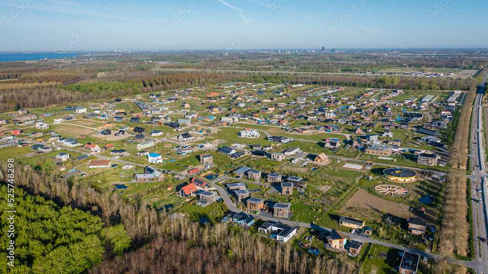 New rural neighbourhood Hout in Almere, The Netherlands, surrounded by nature. Aerial view.