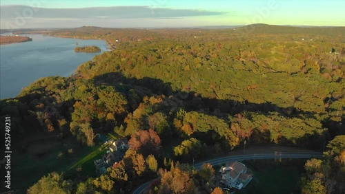 Drone shot of Hudson valley river in upstate new york with green trees and forest in a sunset 4K UHD 3840