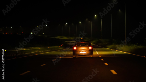 white car in night on Highway road