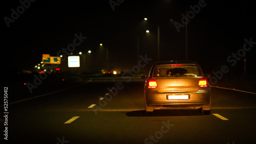 white car in night on Highway road