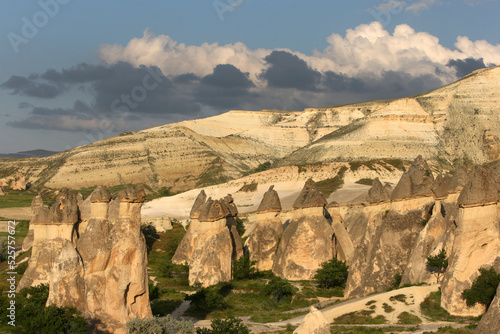 A series of volcanic rock formations known as fairy chimneys at Pasabagi near Zelve in the Cappadocia region of Turkey at sunset.