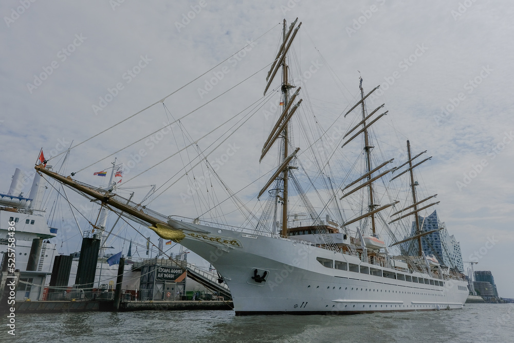 Luxury sailing clipper windjammer cruiseship cruise ship liner Sea Cloud Spirit in port of Hamburg, HH Germany with cityscape skyline and Elbphilharmonie