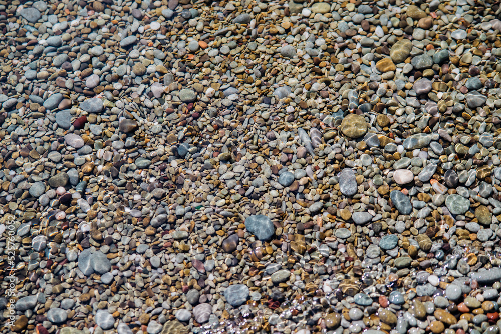 Waves on the seashore. A clear sunny day. Clear, clean sea water. Holidays on the coast. Natural background and texture. Waves on the seashore. A clear sunny day. Clear, clean sea water. Holidays on the coast. Natural background and texture.