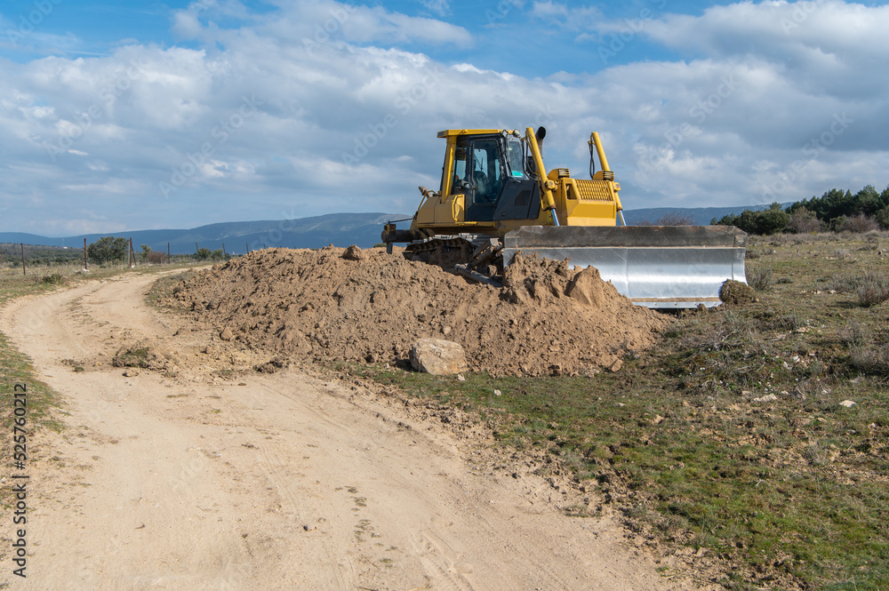 Excavator moving dirt and sand at a construction site Excavator moving dirt and sand at a construction site