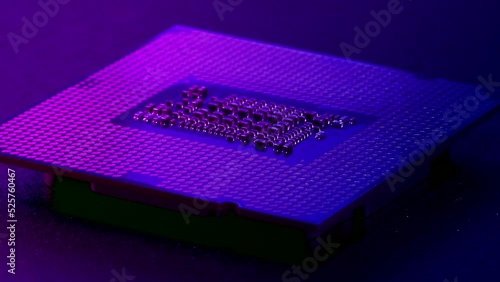 Computer CPU chip rotating - close up video. Shallow field of view. Macro shot of technology background.