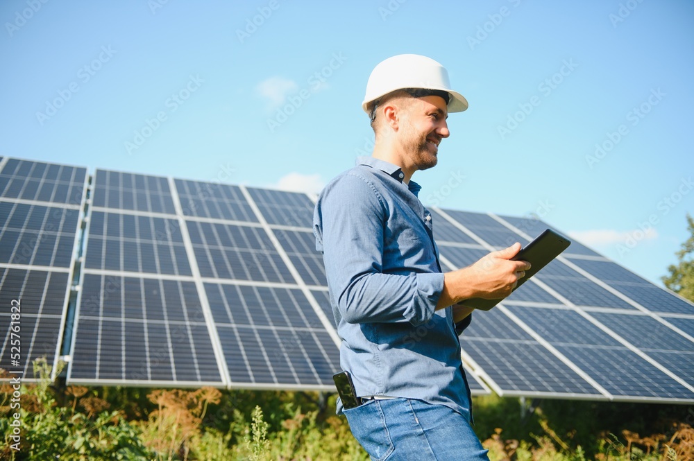 The solar farm(solar panel) with engineer check the operation of the system, Alternative energy to conserve the world's energy, Photovoltaic module idea for clean energy production The solar farm(solar panel) with engineer check the operation of the system, Alternative energy to conserve the world's energy, Photovoltaic module idea for clean energy production
