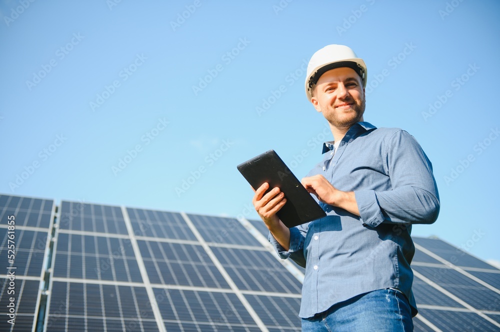 Solar power plant. Engineer on a background of photovoltaic panels. Science solar energy. Solar power plant. Engineer on a background of photovoltaic panels. Science solar energy.