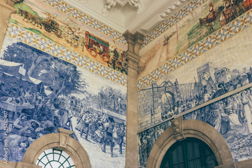 Details of historical paintings in train station using blue traditional tiles  © Radu