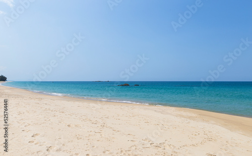 Fine sandy beach with blue sea background  tropical summer beach  tropical island in south of Thailand