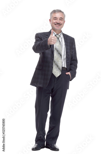 casual smiling man pointing somewhere up . isolated on a white