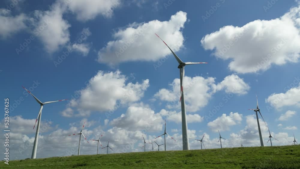 Wind Turbines Spinning Creating Clean Energy On A Sunny Day Wind Turbines Spinning Creating Clean Energy On A Sunny Day