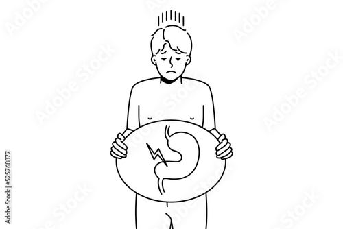 Unhealthy man suffer from indigestion problem. Unhappy sick guy holding image of sick body organ struggle with stomachache. Healthcare concept. Vector illustration. 