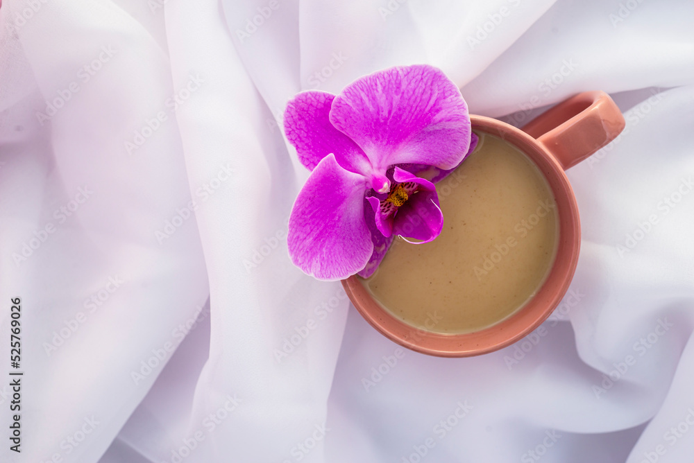 violet orchid flower pink cup of latte coffee with milk white Tulle wood background, top view flatlay morning relax violet orchid flower pink cup of latte coffee with milk white Tulle wood background, top view flatlay morning relax