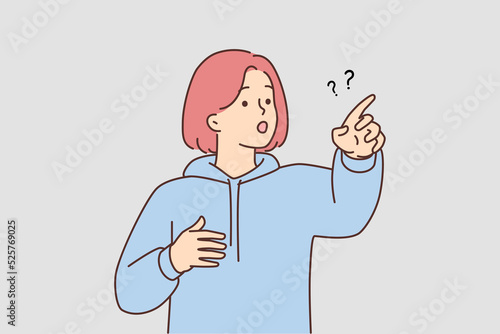 Frustrated girl point with finger at something 