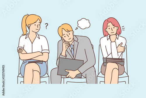 Diverse people in line waiting for interview 