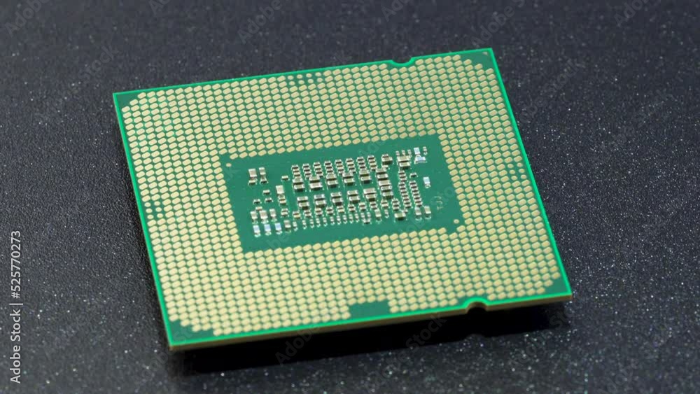 Computer CPU chip rotating - close up video. Shallow field of view. Macro shot of technology background. Computer CPU chip rotating - close up video. Shallow field of view. Macro shot of technology background.