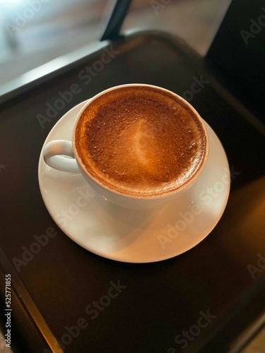 Hot coffee cup on table in cafe