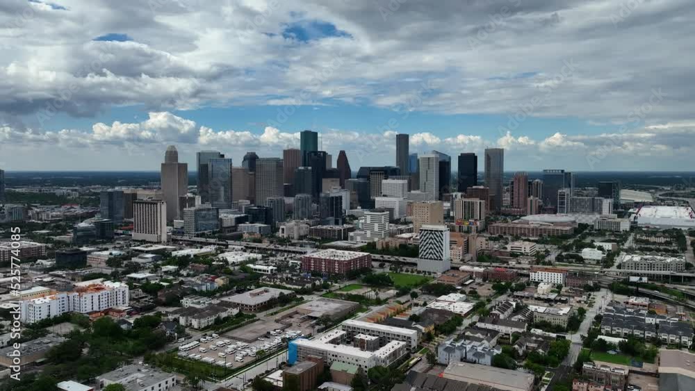 Drone moving backwards over suburbs with Houston skyline in the background - End screen Drone moving backwards over suburbs with Houston skyline in the background - End screen
