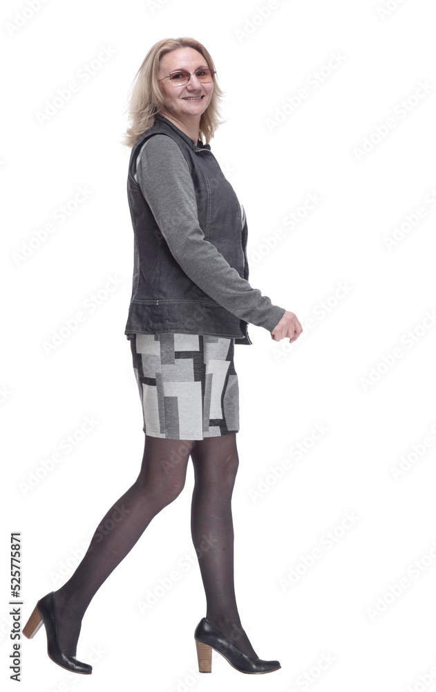 side view. confident young woman striding forward. side view. confident young woman striding forward.