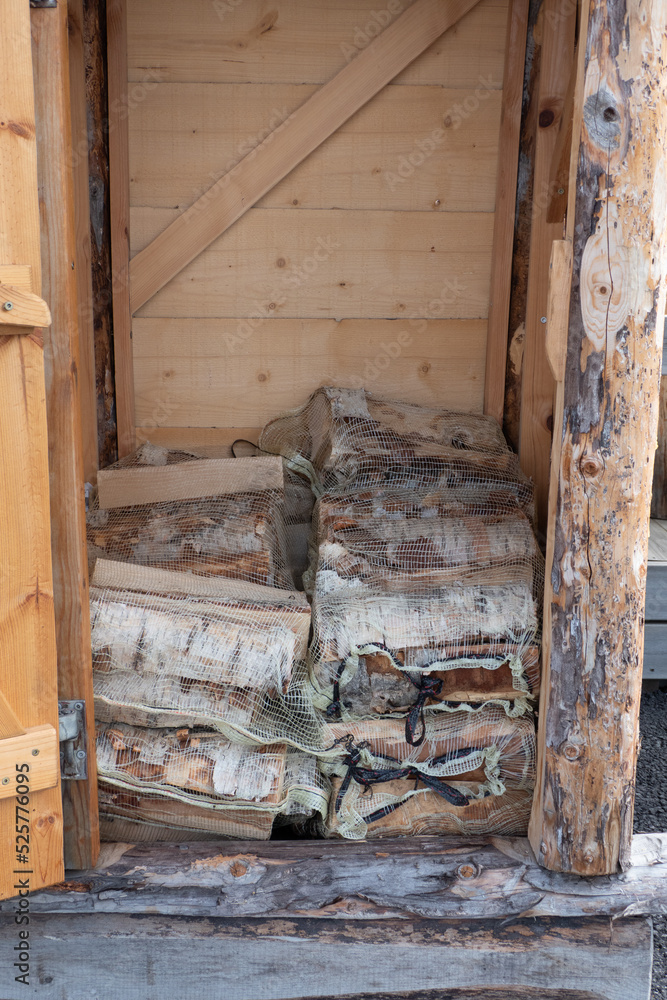Sorsele, Sweden Stacks of firewood for sale from a small wooden cupboard at a market. Sorsele, Sweden Stacks of firewood for sale from a small wooden cupboard at a market.