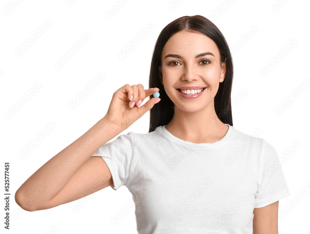 Young woman with vitamin pill on white background Young woman with vitamin pill on white background