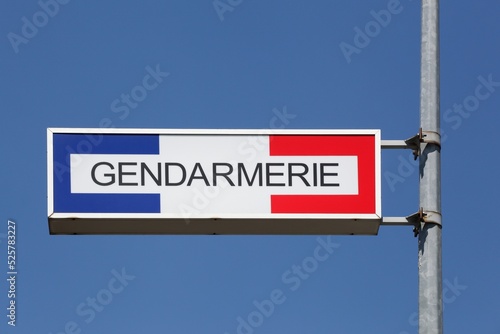 Sign of the french gendarmerie on a pole photo