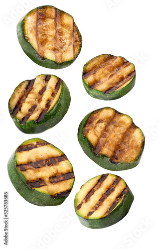 falling grilled sliced zucchini isolated on white background.