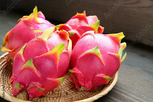 Heap of Fresh Ripe Vivid Pink Dragon Fruits in a Basket