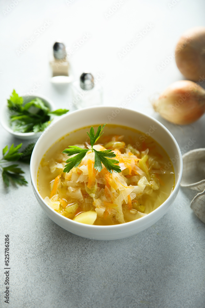 Traditional homemade sauerkraut soup with fresh parsley Traditional homemade sauerkraut soup with fresh parsley